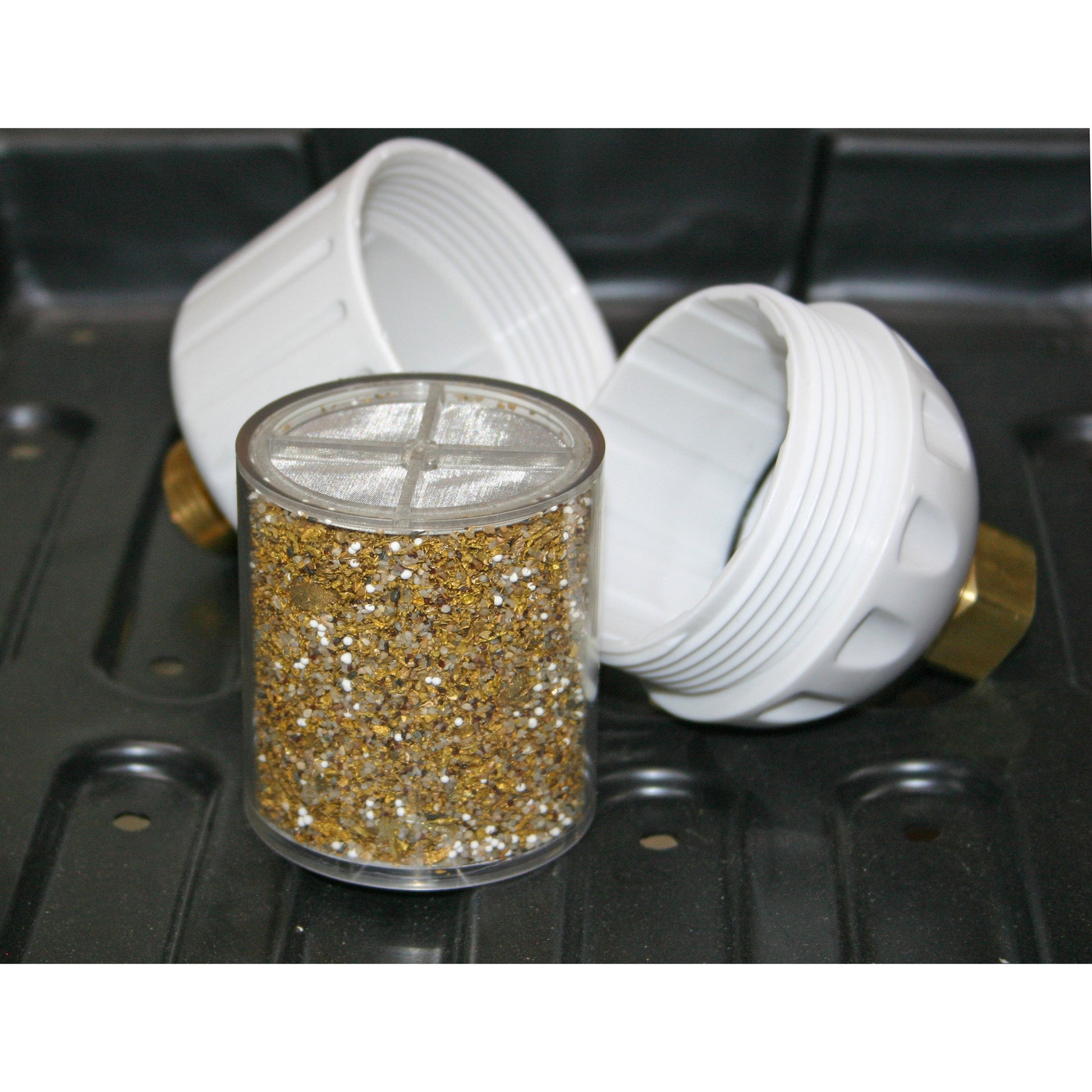 The Chlorgon Water Filter Replacement Cartridge is placed on a black table, with the lid open