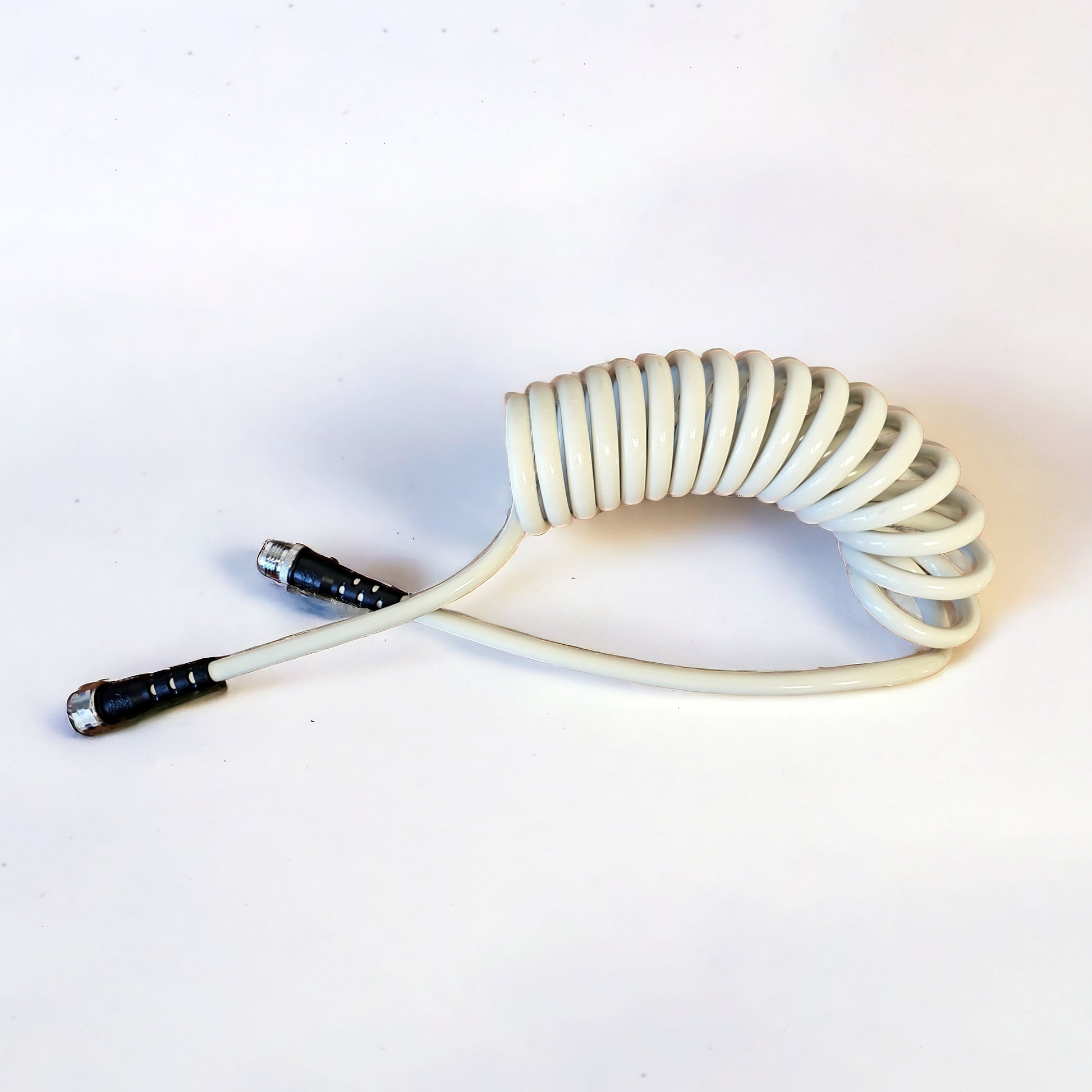 Coiled Garden Hose – 3/8” ID: image of the white coiled garden hose 